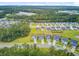 Overhead view of a neighborhood with modern homes and lush green landscapes, near shopping and natural areas at 135 Cypress Preserve Blvd, Moncks Corner, SC 29461