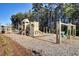 A community playground is nicely situated on a mulch bed and features plenty of equipment for fun and exercise at 135 Cypress Preserve Blvd, Moncks Corner, SC 29461