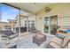 Inviting screened-in porch providing a relaxing outdoor space with hot tub and comfortable seating at 135 Cypress Preserve Blvd, Moncks Corner, SC 29461