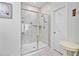 Glass enclosed tiled shower with multi-shelf and shower head; bathroom with door access at 135 Cypress Preserve Blvd, Moncks Corner, SC 29461