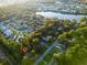 Aesthetic aerial view of homes nestled by a lake and surrounded by lush greenery at 1351 Winifred St, Mount Pleasant, SC 29464