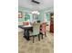 A dining room with a table and colorful chairs, decorative lights and a wooden hutch at 1351 Winifred St, Mount Pleasant, SC 29464