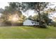 Well-maintained single-story home with a lush green lawn and mature trees providing shade and curb appeal at 1351 Winifred St, Mount Pleasant, SC 29464