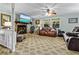 Cozy living room features a stone fireplace, leather sofas and lots of natural light at 1351 Winifred St, Mount Pleasant, SC 29464