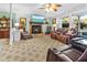 Comfortable living room with stone fireplace, leather sofas, and views of the outdoors at 1351 Winifred St, Mount Pleasant, SC 29464
