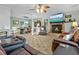 Open living room with fireplace, dining area and cozy leather sofas at 1351 Winifred St, Mount Pleasant, SC 29464