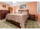 Cozy main bedroom features wood furniture and a comfortable bed with drawers, offering style and functionality at 1351 Winifred St, Mount Pleasant, SC 29464