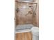 Modern shower with glass door, tile surround, and multiple shower heads for a spa-like experience at 1351 Winifred St, Mount Pleasant, SC 29464