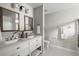 Bright bathroom featuring a double vanity, framed mirrors, and modern fixtures at 1420 Wellesley Cir, Mount Pleasant, SC 29466