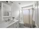 Bright bathroom featuring a vanity with hard surface counters and a shower-tub combo at 1420 Wellesley Cir, Mount Pleasant, SC 29466
