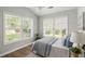 Inviting bedroom featuring natural light, ceiling fan, and minimalist décor at 1420 Wellesley Cir, Mount Pleasant, SC 29466