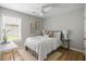 Comfortable bedroom with natural light from the window and neutral decor at 1420 Wellesley Cir, Mount Pleasant, SC 29466