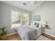 Inviting bedroom with large window, ceiling fan, and minimalist décor at 1420 Wellesley Cir, Mount Pleasant, SC 29466