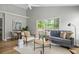 Cozy living room with vaulted ceilings, a large sliding glass door, and comfortable modern furnishings at 1420 Wellesley Cir, Mount Pleasant, SC 29466