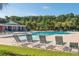 Inviting community pool with sun loungers and convenient pool house at 1420 Wellesley Cir, Mount Pleasant, SC 29466
