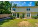 Townhome building with green front doors and nicely landscaped yard at 1423 Ashley River Rd # 3A, Charleston, SC 29407