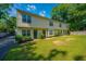 Townhome building with green front doors and nicely landscaped yard at 1423 Ashley River Rd # 3A, Charleston, SC 29407