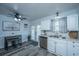 Bright kitchen featuring stainless steel appliances, white cabinets, and a view to the fenced backyard at 1423 Ashley River Rd # 3A, Charleston, SC 29407