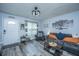 Inviting living room with gray sofa, accent chair, and stylish decor, showcasing the home's cozy atmosphere at 1423 Ashley River Rd # 3A, Charleston, SC 29407