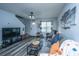 Bright living area with modern furniture, wood-look floors, and lots of natural light, enhancing its appeal at 1423 Ashley River Rd # 3A, Charleston, SC 29407