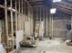 Unfinished basement ready for customization with exposed brick and wooden framing, offering potential for renovation at 1488 Remount Rd, North Charleston, SC 29406
