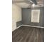 Comfortable bedroom featuring a ceiling fan, dark vinyl floors and modern wall trim at 1488 Remount Rd, North Charleston, SC 29406