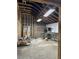 Unfinished commercial space with exposed brick walls, wooden framing and stainless steel equipment at 1488 Remount Rd, North Charleston, SC 29406
