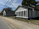 Charming home exterior with updated siding, large windows, and a well-maintained mailbox at 1488 Remount Rd, North Charleston, SC 29406
