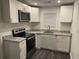 Modern kitchen features stainless steel appliances, granite countertops, and ample cabinet space at 1488 Remount Rd, North Charleston, SC 29406