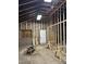 Unfinished room with exposed brick and wooden framing offers potential for customization at 1488 Remount Rd, North Charleston, SC 29406