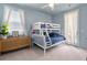 Light blue bedroom featuring a bunk bed, and woven cabinet with a white framed picture at 1535 Low Pk St, Mount Pleasant, SC 29464