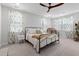 Bedroom with large window, ceiling fan and white carpet at 1535 Low Pk St, Mount Pleasant, SC 29464