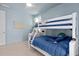 Light blue bedroom showcasing a bunk bed with blue bedding and toys for decor at 1535 Low Pk St, Mount Pleasant, SC 29464