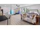 Bright and open bedroom includes a bed, sofa, and fun workout equipment at 1535 Low Pk St, Mount Pleasant, SC 29464