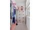Organized closet with shelves, hanging clothes, and a window for natural light at 1535 Low Pk St, Mount Pleasant, SC 29464