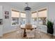 Bright dining room with round wooden table and white chairs at 1535 Low Pk St, Mount Pleasant, SC 29464
