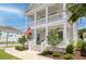 Inviting home exterior featuring a double porch, manicured landscaping, and a warm, welcoming ambiance at 1535 Low Pk St, Mount Pleasant, SC 29464