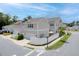 Corner lot featuring manicured landscaping, a fenced yard, and a two-car garage at 1535 Low Pk St, Mount Pleasant, SC 29464