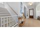 Inviting foyer with wood floors, staircase, decorative table, and a glimpse into adjoining rooms at 1535 Low Pk St, Mount Pleasant, SC 29464