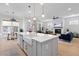 Open concept kitchen and living room with white kitchen island at 1535 Low Pk St, Mount Pleasant, SC 29464