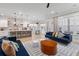 Open concept kitchen and living room with blue couches at 1535 Low Pk St, Mount Pleasant, SC 29464