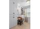 This home office features custom cabinetry, built-in desk, and a light wood floor at 1535 Low Pk St, Mount Pleasant, SC 29464