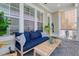 Cozy outdoor patio seating area with modern furniture and wooden table at 1535 Low Pk St, Mount Pleasant, SC 29464