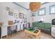 Well-lit playroom with dual desks, decorative accents, and a variety of toys and storage options at 1535 Low Pk St, Mount Pleasant, SC 29464