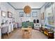 Bright playroom with blue trim, playful decor, dual desks, and ample space for activities at 1535 Low Pk St, Mount Pleasant, SC 29464