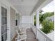 Spacious porch featuring rocking chairs, offering a relaxing outdoor space with a pleasant view at 1535 Low Pk St, Mount Pleasant, SC 29464