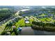An aerial view of a Primary planned community boasting lush landscaping and various colored houses at 154 Calm Water Way, Summerville, SC 29486