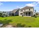 Expansive backyard with lush lawn, ideal for recreation and relaxation, including an in-ground pool at 154 Calm Water Way, Summerville, SC 29486