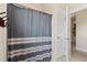 Bathroom featuring a shower with a striped shower curtain and a white door at 154 Calm Water Way, Summerville, SC 29486