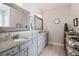 Bathroom with double sink, granite countertops and mirrors at 154 Calm Water Way, Summerville, SC 29486